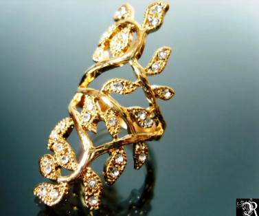 Rhinestone studded gold ring. Find it on www.rehmaans.com